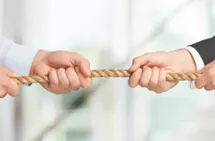 Two hands holding on to a rope