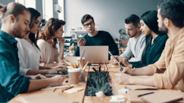 A group of people sitting around a table.